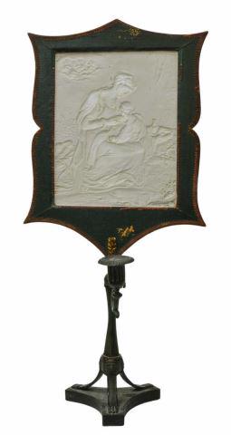 CAST IRON & LITHOPHANE PORCELAIN CANDLE LAMP: Bisque porcelain Lithophane tile on candle lamp stand, 19th c., depicting the Madonna and Christ child, a chorus of angels in upper left corner, cast iron candle stand in a verdigris finish, tripod ba
