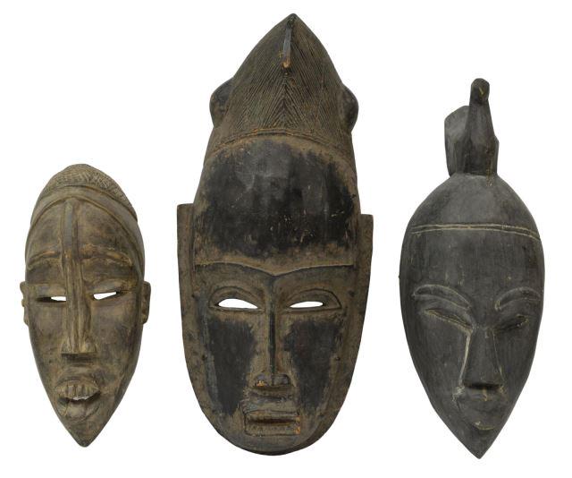 (3) AFRICAN BAULE & OTHER CARVED WOOD MASKS: (lot of 3) African carved wood masks, including: (1) face surmounted by a forward-facing bird, (1) figure with open mouth and coiffed hair, (1) smaller mask with well-defined features, examples likely