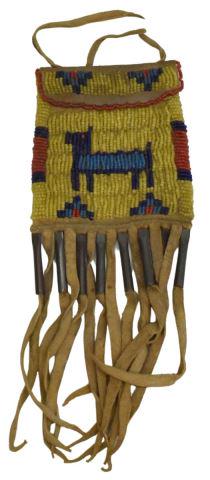 PLAINS-STYLE BEADED HIDE BAG W/ FRINGE: Plains-style beaded hide bag, third quarter 20th c. or later, depicting animal at front, fringe with metal cones, approx 8.25"l, 3.5"w (inclusive of fringe) Start Price: $50.00