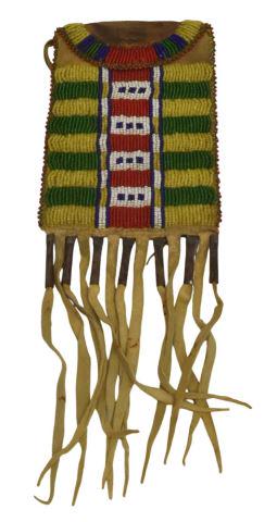 PLAINS-STYLE BEADED HIDE BAG W/ FRINGE: Plains-style beaded hide bag, third quarter 20th c. or later, with fringe and metal cones, approx 11.5"l, 4.25"w (inclusive of fringe) Start Price: $50.00