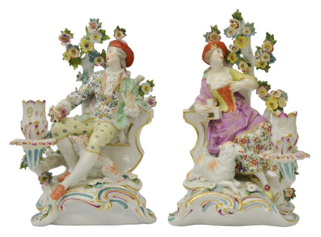 (2) ENGLISH CHELSEA PORCELAIN FIGURAL CANDLESTICKS: (lot of 2) English porcelain figural candlesticks, Chelsea Porcelain Manufactory, c.1756-1769, gold anchor period, Rococo-taste man and woman reclining under a tree, the woman with open bird cage, a l