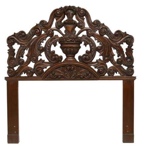 HAND-CARVED MAHOGANY BED HEADBOARD: Hand-carved mahogany headboard, late 20th c., central urn with flowers, framed by scrolling foliates, approx 61.25"h, 58.5"w Start Price: $100.00
