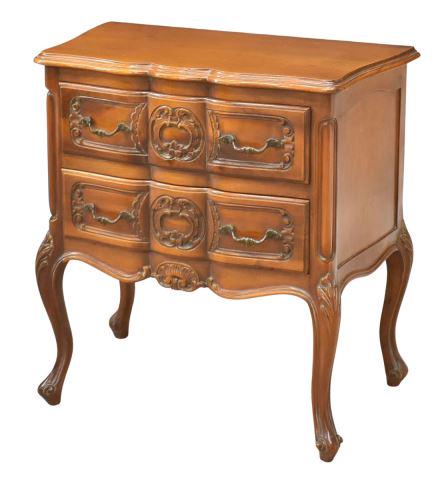 FRENCH LOUIS XV STYLE FRUITWOOD NIGHTSTAND: French Louis XV style fruitwood nightstand, 20th c., having a shaped top, over case fitted with two serpentine drawers, with carved foliate motifs, shaped apron with center shell motif, on cabriole le