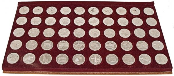 50 FRANKLIN MINT ONE OUNCE STERLING SILVER STATES: The Franklin Mint States of the Union Series, Governors' Edition, fifty (50) one ounce 30mm medals, each representing a separate state, originally in a wood box, only the base of the box now present, 