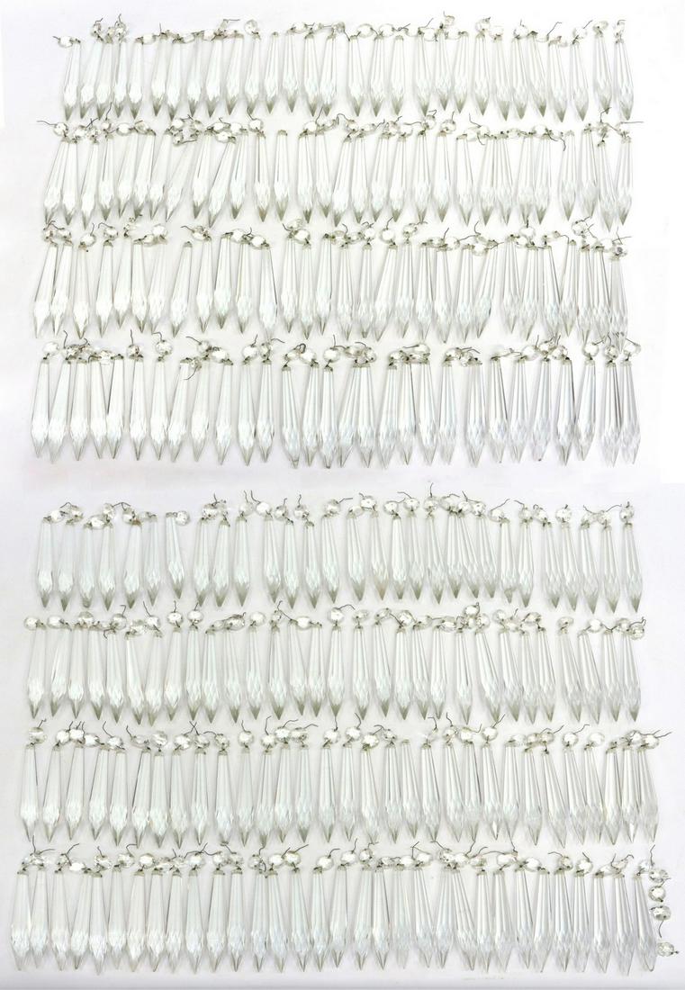 (138) CHANDELIER U-DROP CRYSTAL PRISMS 5.75"L: (lot of 138) Chandelier u-drop crystal prisms, faceted spear form with top bead, two drops with chips, drops including bead: 5.75"l, total: 24.60lbs Start Price: $80.00