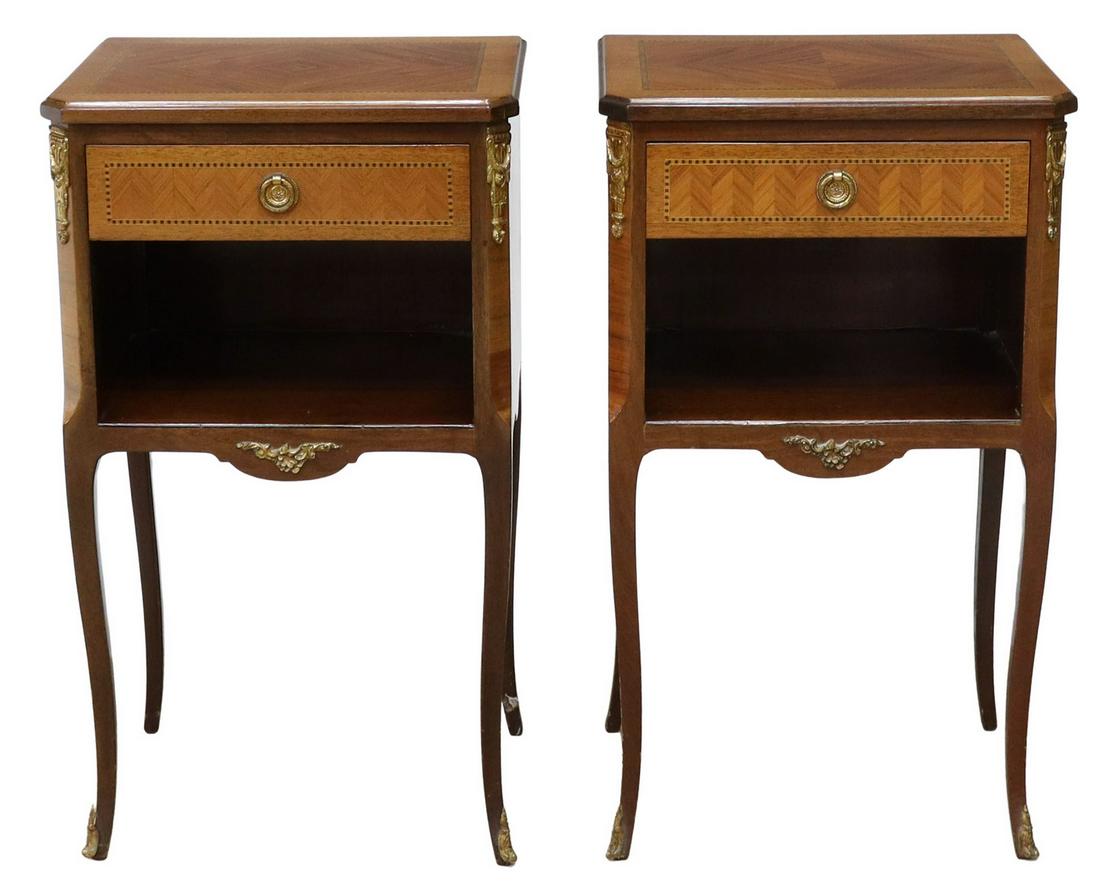 (2) FRENCH LOUIS XVI STYLE MAHOGANY NIGHTSTANDS: (pair) French Louis XVI style mahogany nightstands, mid 20th c., shaped top, over matched veneer case with parquetry trim, fitted with single drawer above open niche, foliate gilt metal mounts, on tra