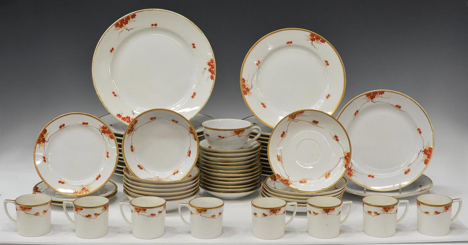 (56) JAPANESE SUZUKI COMPANY DINNER SERVICE: (lot of 56) Japanese Suzuki Company porcelain dinner service, having gilt trim and floral accents, marked underfoot, comprising: (11) dinner plates, (one) with minute chip, approx 10"diam, (12) salad 