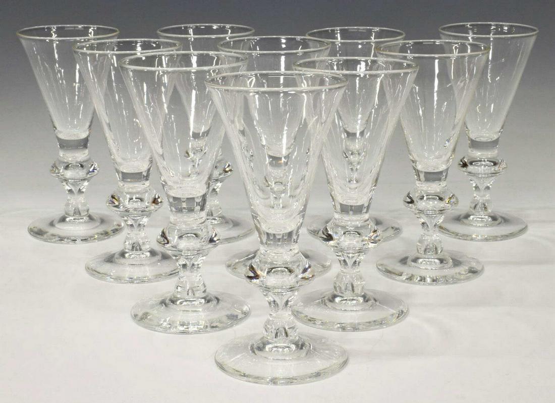 (10) STEUBEN 'TRUMPET' GLASS CRYSTAL WINE STEMS: (lot of 10) Steuben Glass crystal wine stems in pattern '7737', trumpet form rising on suspended tear drop bubble base, engraved signature underfoot, 5 3/4"h, 2 3/4" diam, (one) with chip to foot, 4.5