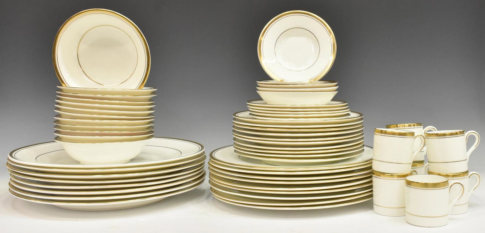 (56) COALPORT 'CONNOISSEUR' BONE CHINA SERVICE: (lot of 56) English Coalport bone china dish service, in "Connoisseur" pattern, gilt trim on white ground, maker's mark underfoot, comprising: (8) chargers, approx 12"diam, (9) dinner plates, approx 1