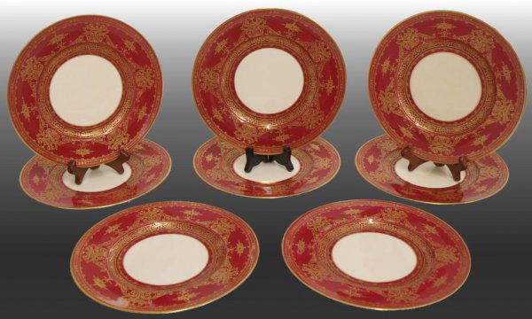 ROYAL WORCESTER PORCELAIN PLATES FOR TIFFANY & CO.: (set of 8) Royal Worcester porcelain cabinet plates, retailed by Tiffany & Co. of New York, c. 1927, deep red borders decorated with raised gilding in profusely elaborate urn and foliate patterns encl