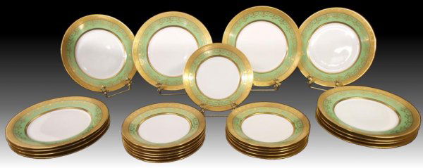 HUTCHENREUTHER PORCELAIN GILDED SERVICE PLATES: (lot of 24) Hutschenreuther porcelain service plates, each having a wide green band with extensive gilt embellishments, including (12) dinner plates, 10"diam.; (12) salad plates 8" diam; marked "Hutsc