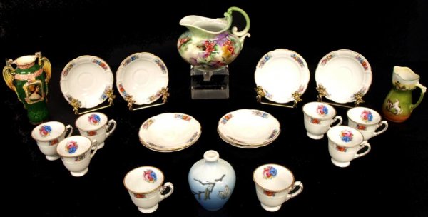 MAJOLICA PORTRAIT DRAGON VASE & ASSORTED PORCELAIN: (lot of 20) Collection of assorted porcelains comprising: a Rosenthal pitcher, hand painted in a grape motif, the interior luster iridescent, 6"h, 7"w, 6"d; (16) cups with (16) saucers in a delicate l