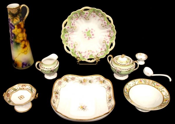 COLLECTION OF NIPPON HAND PAINTED PORCELAIN: (lot of 9) Group of Nippon hand decorated porcelain, early 20th c., comprising: (1) large pitcher completely decorated with grapes and accented with gilt enameling, 11.5"h; (2) footed center bowls, ea