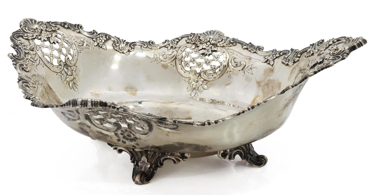 TIFFANY & CO. MAKERS STERLING CENTERPIECE BOWL: American sterling silver centerpiece bowl, Tiffany & Co. Makers, c.1902-1907, directorship of Charles T. Cook, scrolled rim with shells, pierced latticework, raised on four scrolled feet, approx 4.75"