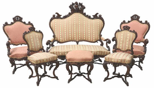 (6) ITALIAN CARVED MAHOGANY CHERUB PARLOR SUITE: (lot of 6) Italian carved mahogany parlor suite, in the manner of Luigi Frullini (Florence, Italy, 1839-1897), 19th c., each having heavily carved mahogany frame with foliate, rocaille, and cherub mot