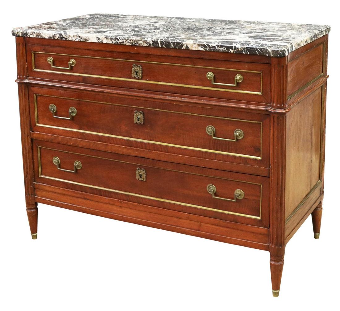 FRENCH LOUIS XVI STYLE MARBLE-TOP MAHOGANY COMMODE: French Louis XVI style marble-top mahogany commode, 19th c., having a marble top over three drawers, flanked by ribbed columns, descending to tapered legs with brass-capped feet, approx 36"h, 46"w, 23