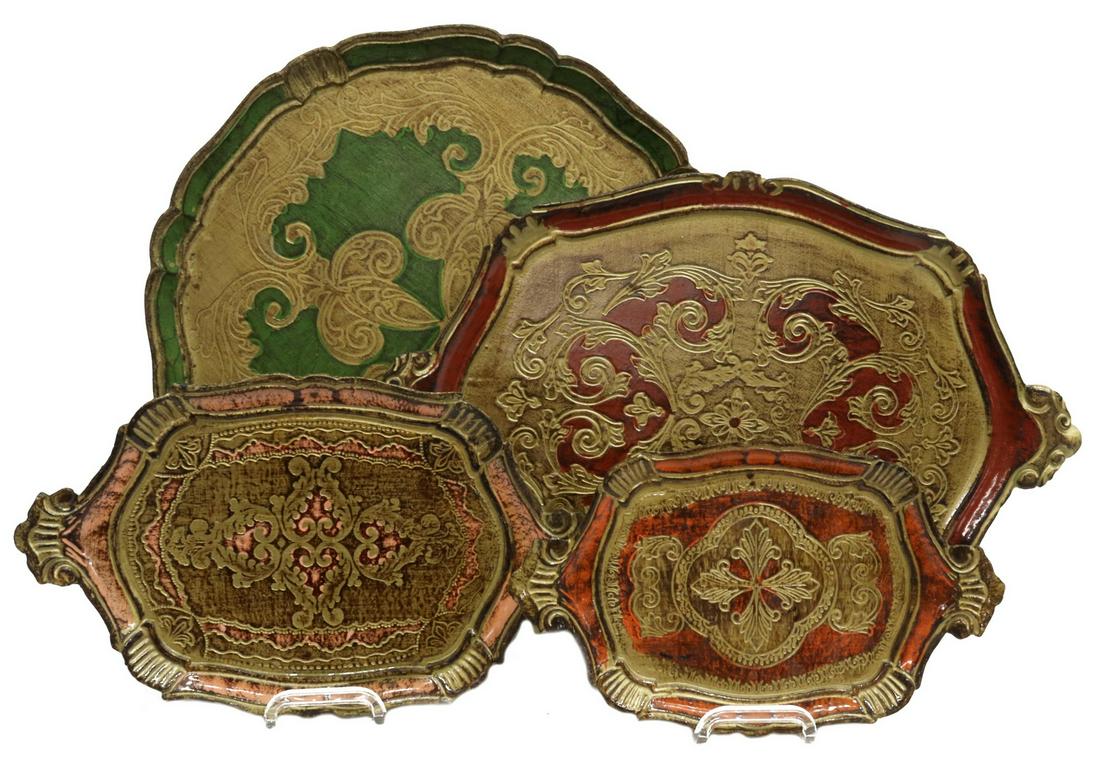 (4) FLORENTINE PARCEL GILT SERVICE TRAYS: (lot of 4) Florentine service trays, 20th c., parcel gilt and polychrome painted, with impressed foliate scroll designs, comprising: (1) round, approx 17.25"diam; (3) oval with foliate handles, larges