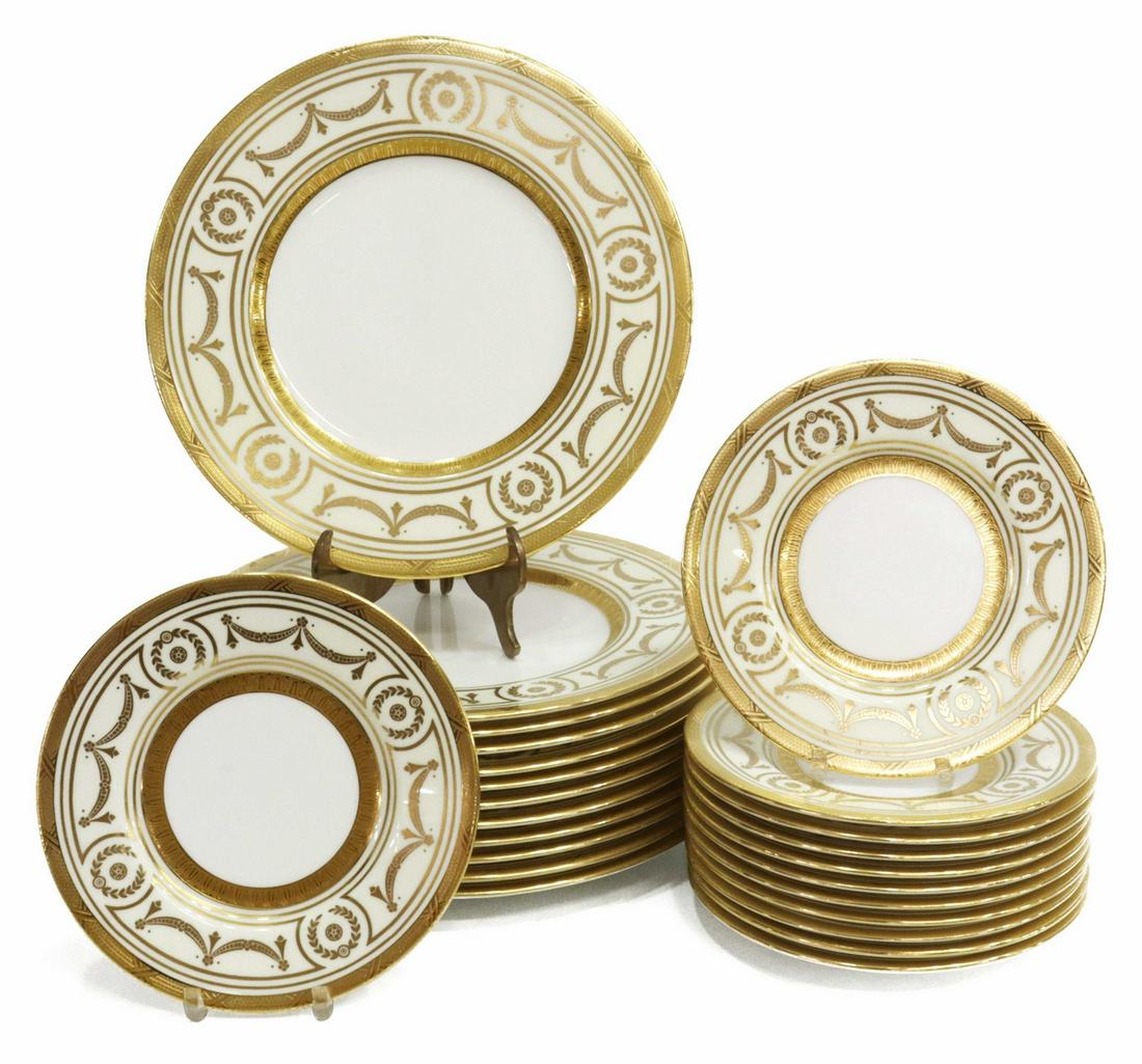 (24) MINTON FOR TIFFANY & CO GILT PORCELAIN PLATES: (lot of 24) English porcelain plates, Minton, retailed by Tiffany & Co., New York, with a raised gilt geometric border, depicting garland and foliate motifs, including: (12) salad/ luncheon plates, ap