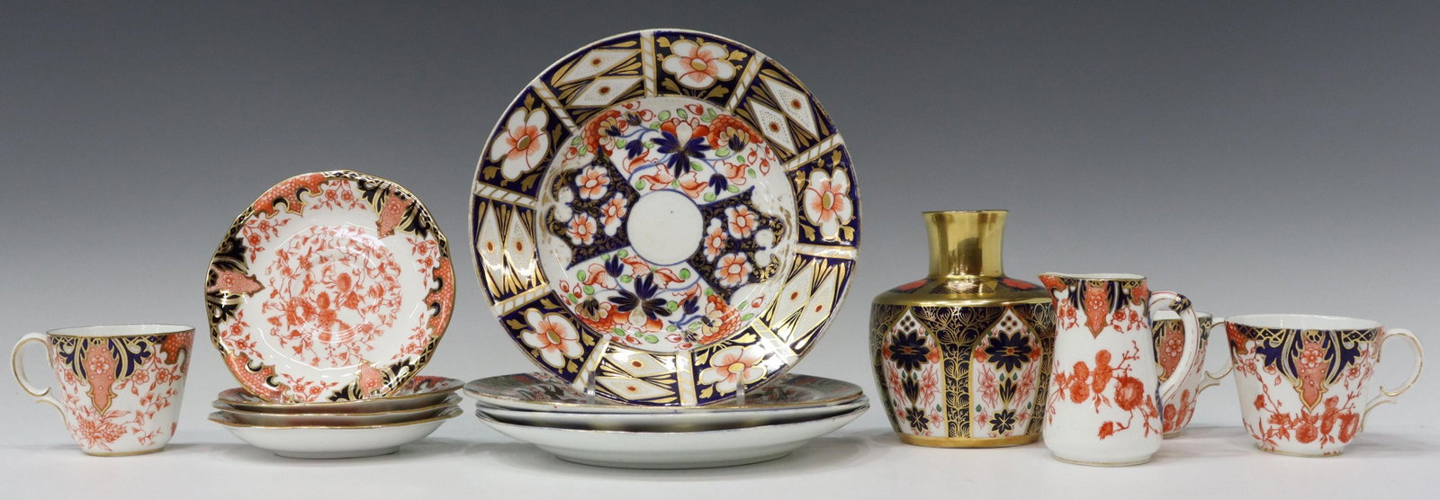 (13) ROYAL CROWN DERBY IMARI PALETTE TABLEWARE: (lot of 13) Royal Crown Derby porcelain tableware, 19th/ 20th c., varied patterns and marks, all in the Imari palette, comprising: (1) bud vase, in the "Old Imari" pattern, approx 4"h, 3.5"diam, (1) c