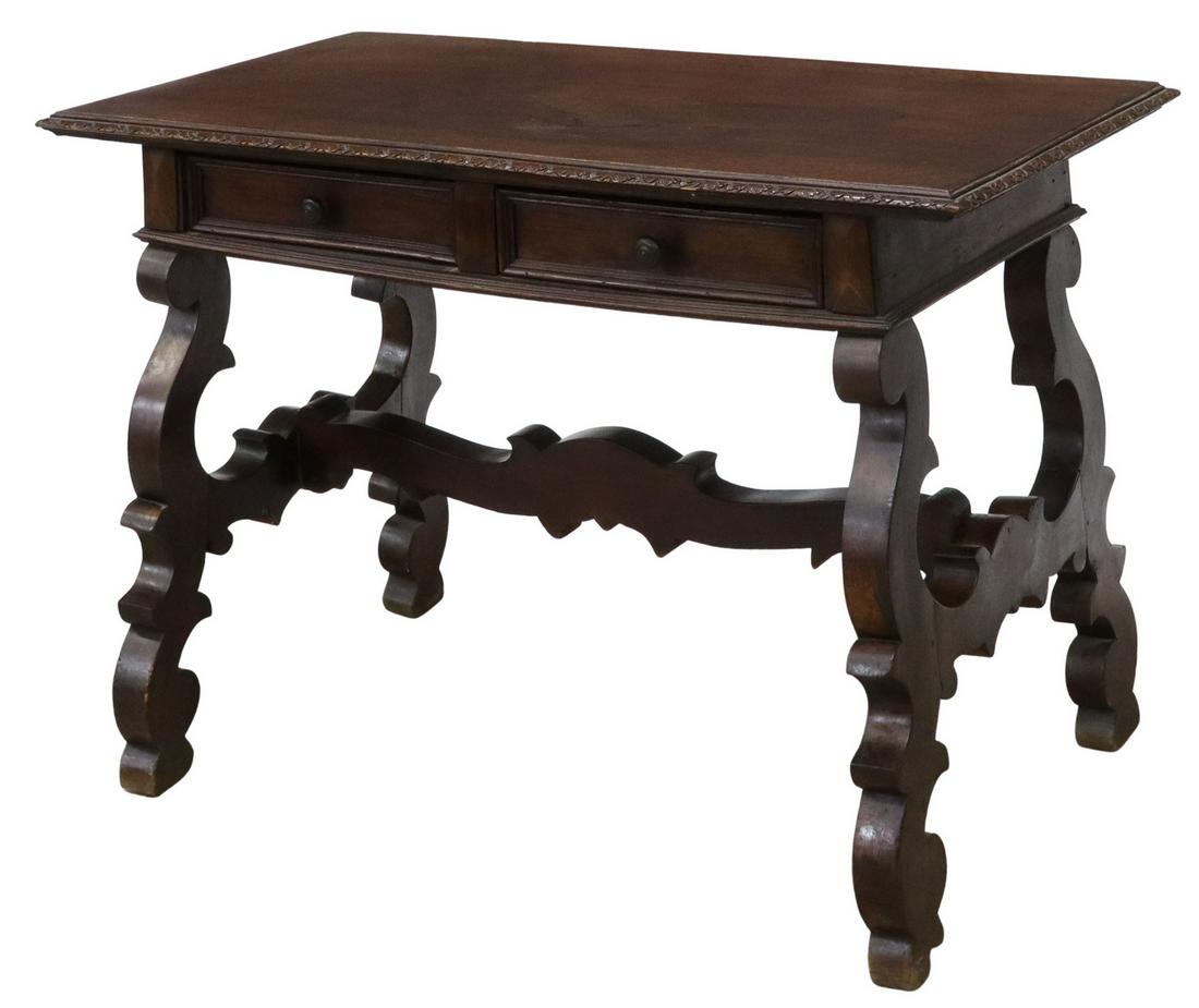 SPANISH BAROQUE STYLE LIBRARY TABLE WRITING DESK: Spanish Baroque style library table/ writing desk, 19th c., single board top with lunette molded edge, over two drawers, rising on shaped ox yoke supports, joined by cross stretcher, approx 32.5"h, 46