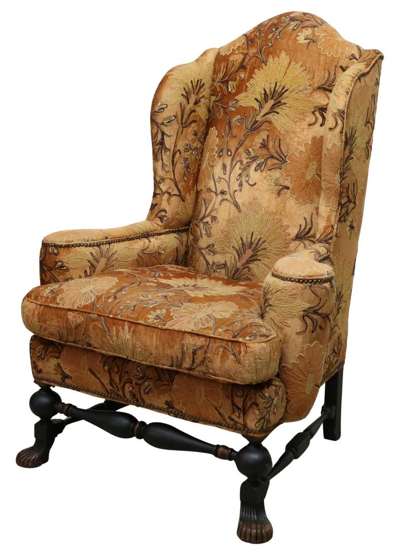 OLD HICKORY TANNERY BAROQUE STYLE WINGBACK CHAIR: Baroque style wingback armchair, Old Hickory Tannery, late 20th c., crewel style machine embroidered upholstery, brass tack trim, loose seat cushion, rising on turned legs, joined by box stretcher, en