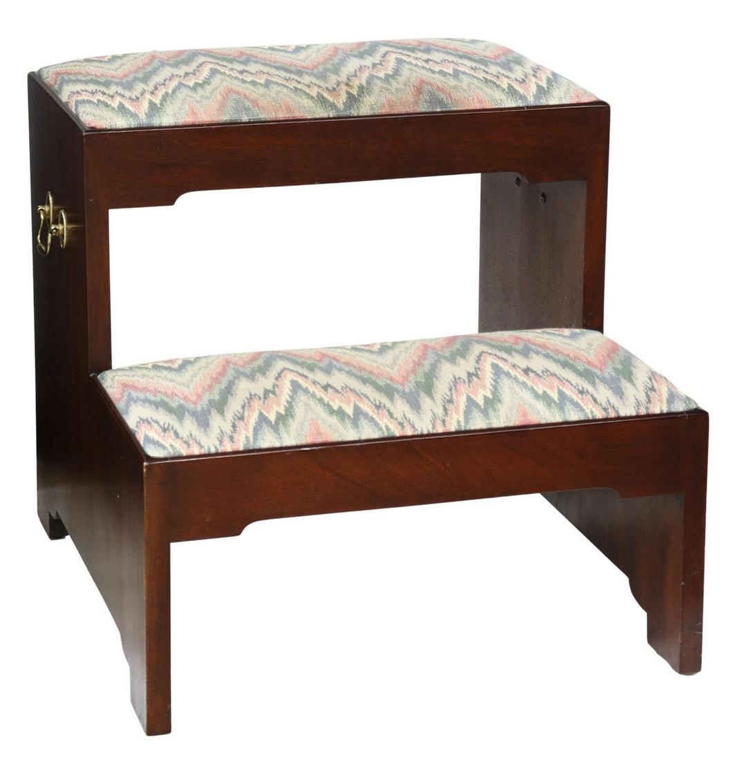 HENKEL HARRIS GEORGIAN STYLE MAHOGANY BED STEPS: Georgian style mahogany bed steps, Henkel Harris, late 20th c., two steps, each with padded top in flame stitch style upholstery, brass bail carrying handles, on bracket feet, approx 17"h, 17"w, 19"d 