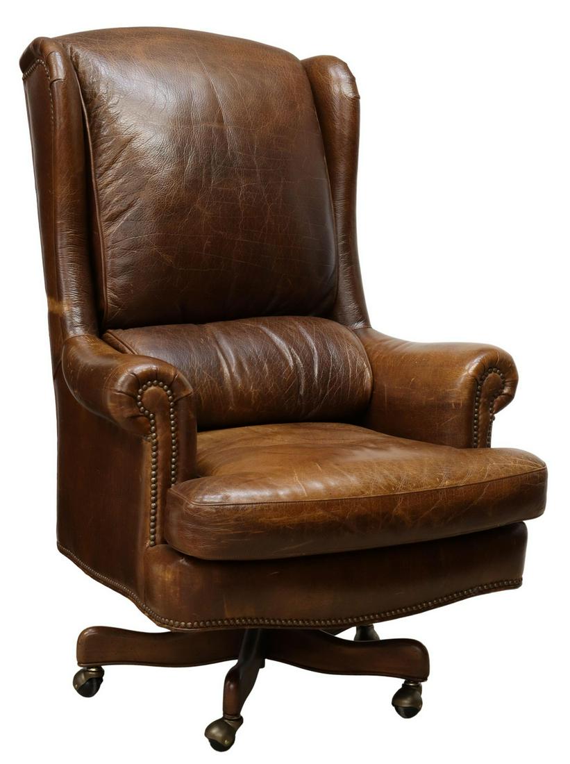 HANCOCK & MOORE EXECUTIVE LEATHER OFFICE CHAIR: Hancock and Moore "Wrenn" leather executive office chair, late 20th c., padded headrest and back with small wings, loose seat cushion, rolled arms with brass tack trim, swivel and tilt pedestal base, 