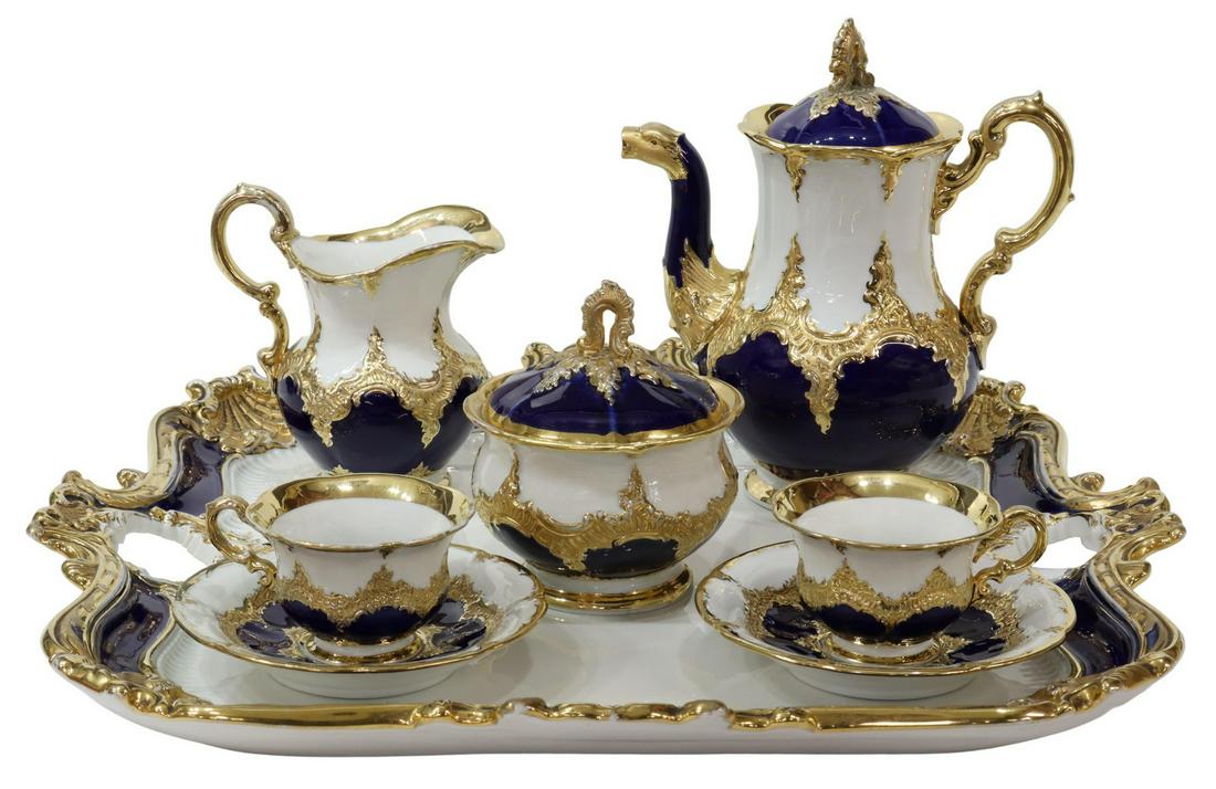 (8) MEISSEN PARCEL GILT & COBALT COFFEE SERVICE: (lot of 8) Meissen parcel gilt and cobalt tete-a-tete coffee service, 19th c., including: (2) demitasse cups with (2) saucers, (one) saucer with restoration, approx 5"diam, (1) coffee pot, with glue r