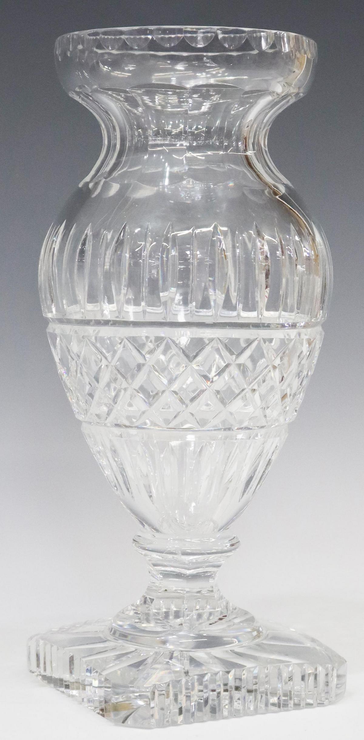 FRENCH BACCARAT CUT CRYSTAL FLOWER VASE: French Baccarat cut crystal vase, vertical and crosshatch cuts, pedestal foot, on a notched square base, approx 11.5"h, 5.25"diam, 6lbs **Provenance: A fine Santa Fe, New Mexico estate collection** St