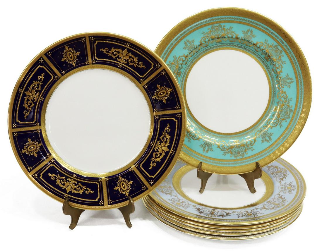 (7) ENGLISH MINTON RAISED GILT PORCELAIN PLATES: (lot of 7) English parcel gilt bone china porcelain plates, Minton, mid to late 20th c., each having a different colored border, with heavily gilded and enameled floral motifs, largest: approx 10.75"d