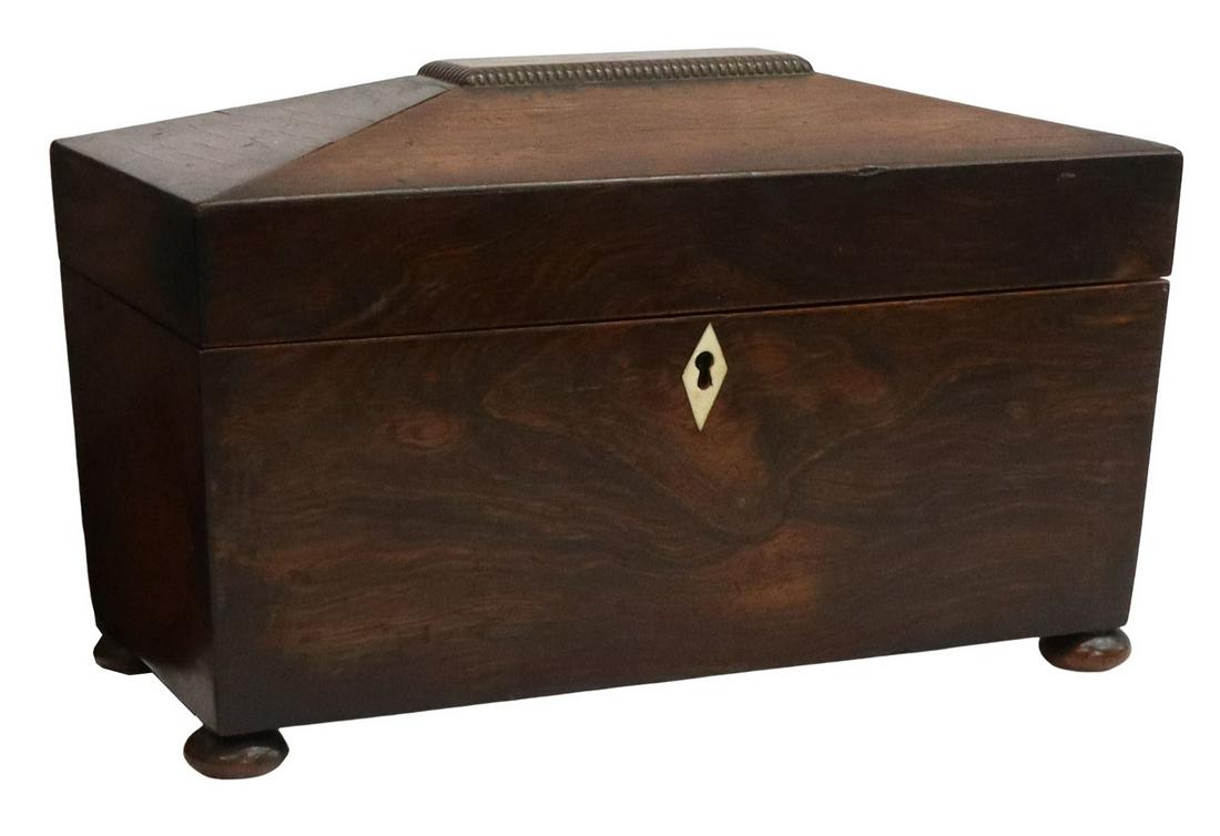ENGLISH ROSEWOOD SARCOPHAGUS-FORM TEA CADDY: English Regency period rosewood tea caddy, early 19th c., the sarcophagus form box with bone diamond-form escutcheon, opening to two lidded compartments, center with circular opening, rising on small 