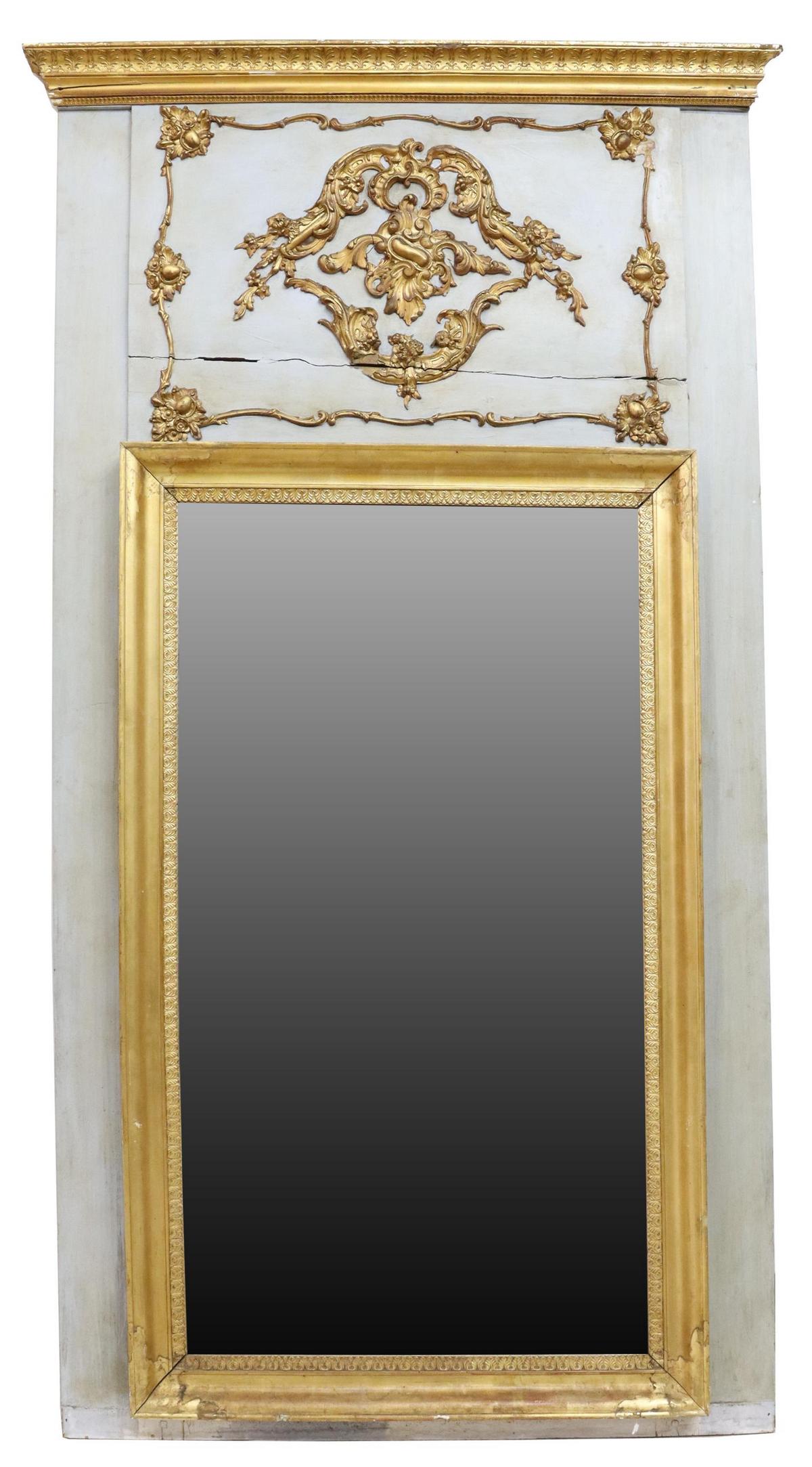 FRENCH PARCEL GILT & PAINTED TRUMEAU MIRROR: French Louis XVI style parcel gilt and painted trumeau mirror, late 19th/ early 20th c., palmette molded cornice, trumeau with applied rocaille molding, ogee-framed flat mirror plate, losses to applie