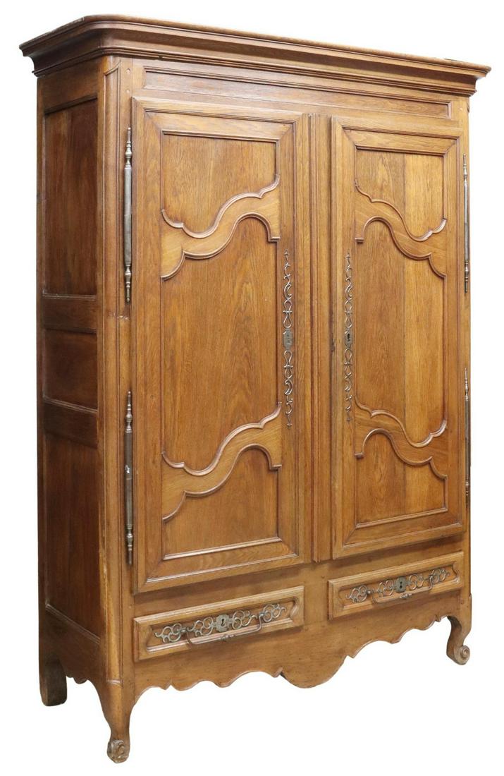 FRENCH PROVINCIAL LOUIS XV STYLE OAK ARMOIRE: French Provincial Louis XV style oak armoire, 19th c., molded cornice, over two scrolled panel doors on exterior hinges, later linen-lined interior with shelves, two exterior drawers below, scalloped 
