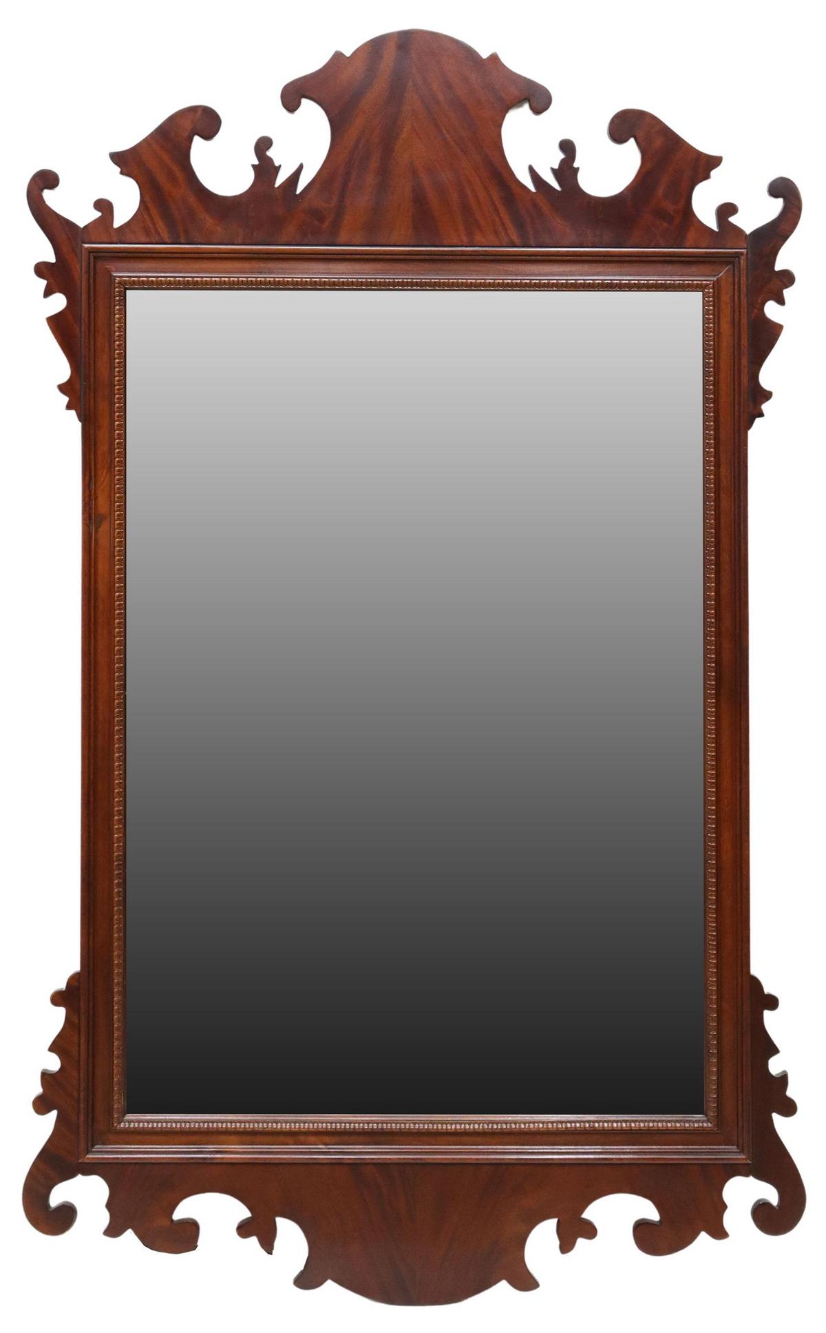 HENREDON GEORGIAN STYLE MAHOGANY BEVELED MIRROR: Georgian style wall mirror, Henredon, late 20th c., shaped flame mahogany frame, centering a beveled mirror plate, approx 54h, 32.5w $100, $150-$300 Start Price: $100.00