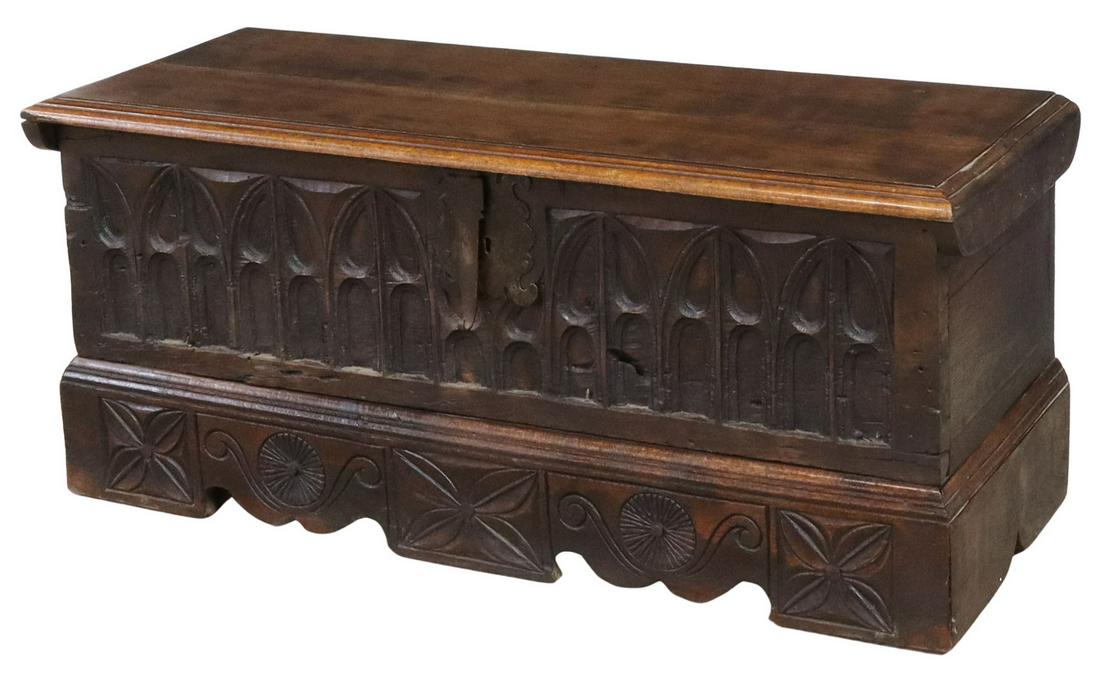 FRENCH GOTHIC REVIVAL CARVED WALNUT STORAGE TRUNK: French Gothic Revival walnut storage trunk, 19th c., hinged top, open interior, front panel carved with pointed arches, tracery designs, rising on bracket feet, approx 19.25"h, 43.25"w, 17"d **Provena