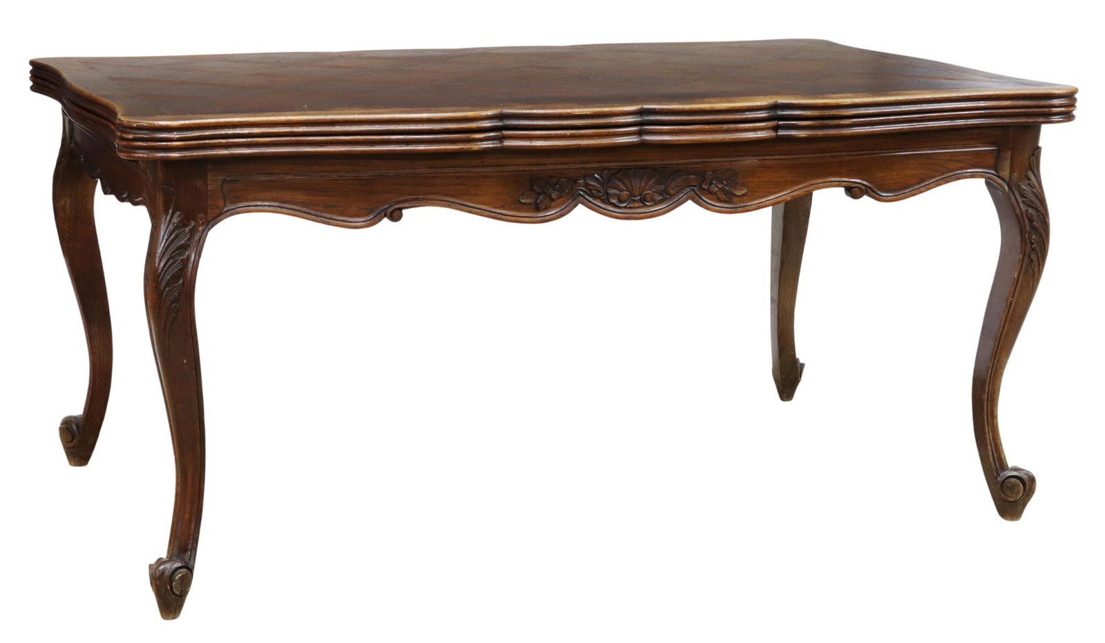 FRENCH LOUIS XV STYLE OAK DRAW-LEAF DINING TABLE: French Provincial Louis XV style oak draw-leaf dining table, 20th c., parquetry tabletop with scalloped edge, conforming apron with shell carving, rising on cabriole legs with foliate-carved knees, en