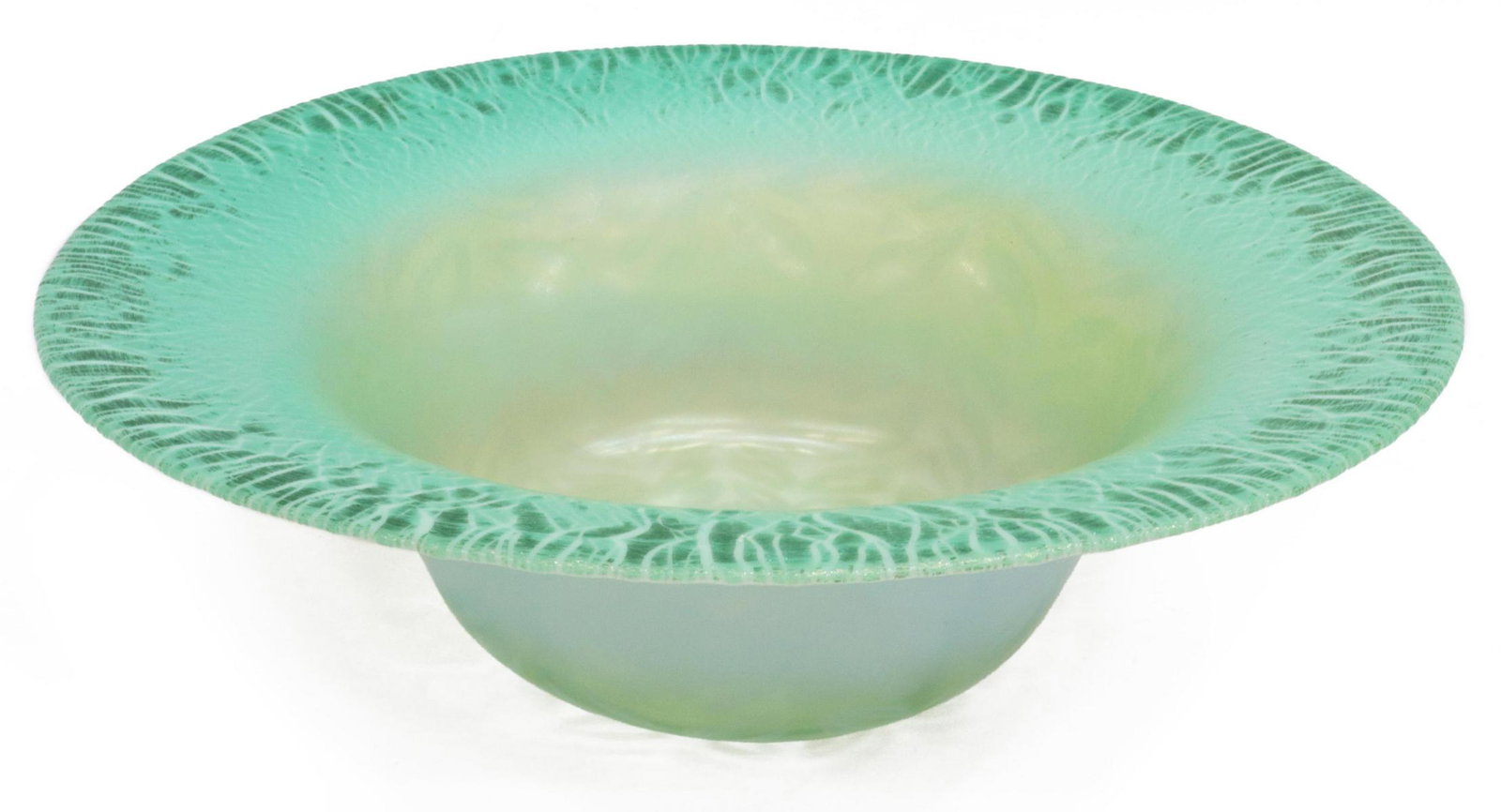 L.C. TIFFANY GREEN FAVRILE GLASS CENTERPIECE BOWL: Favrile art glass centerpiece bowl, Louis Comfort Tiffany (New York, 1848-1933), early 20th c., pale green glass with stretched rim, white opalescent pulled feather design, engraved signature "L.C. Ti