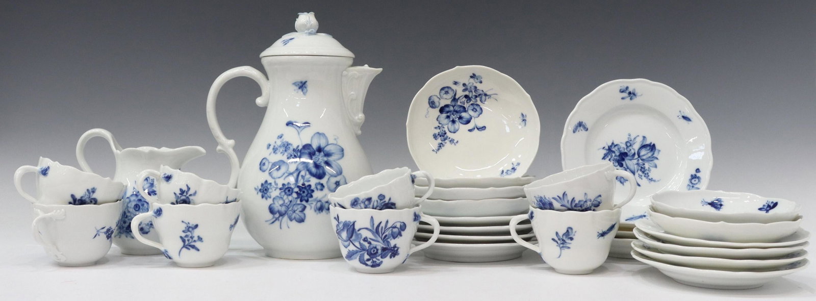 (29) MEISSEN BLUE FLOWER PORCELAIN COFFEE SERVICE: (lot of 29) Meissen porcelain coffee service, with flowers and insects in a blue glaze, including: (8) cups, slightly varied in design and size, (two) with minute chips to rim, largest: approx 3.5"dia