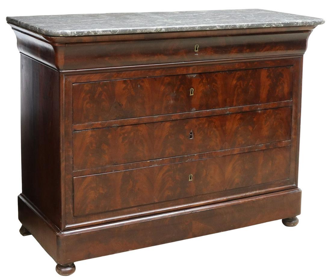 FRENCH LOUIS PHILIPPE MARBLE-TOP MAHOGANY COMMODE: French Louis Philippe period flame mahogany commode, mid 19th c., the marble top over five drawers, the upper and lower drawers appearing as trim, rising on bun feet, approx 39"h, 51"w, 23"d Start Pri
