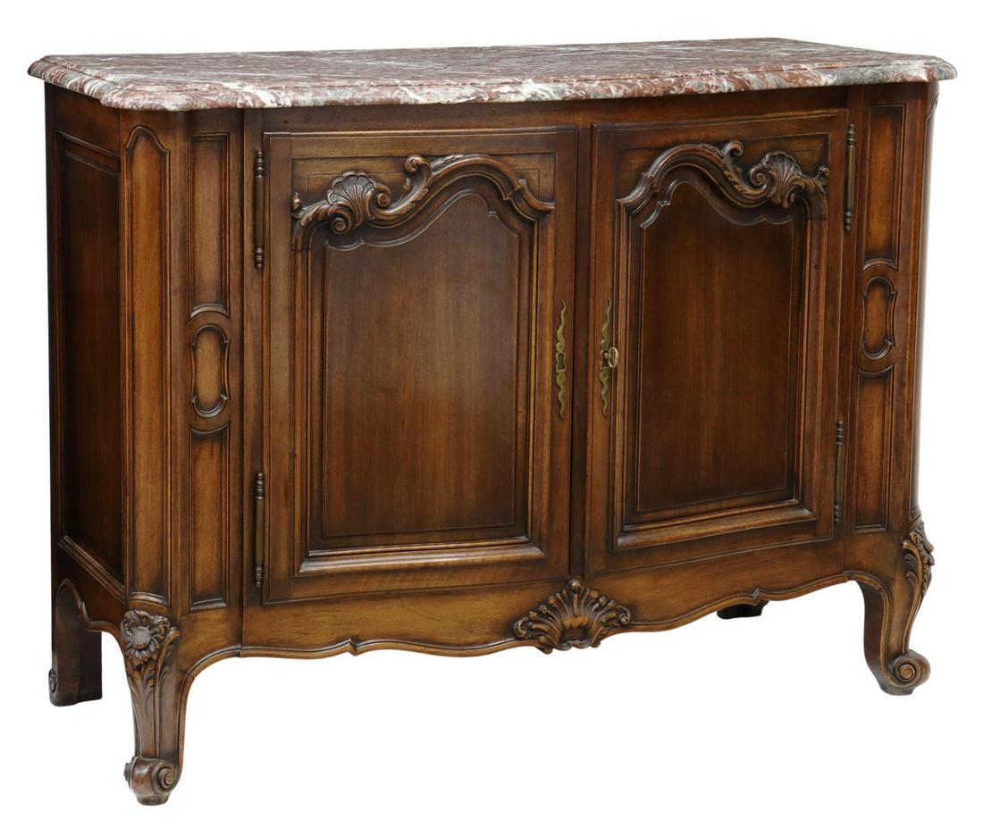 FRENCH LOUIS XV STYLE MARBLE-TOP WALNUT SIDEBOARD: French Louis XV style marble-top walnut sideboard, early 20th c., having shaped rouge marble top, over case fitted with paneled double-door cabinet, opening to interior shelf, carved foliate and shell