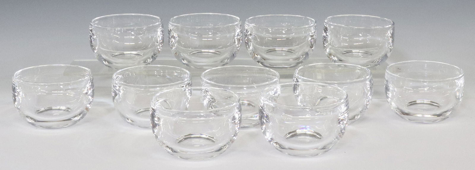 (11) STEUBEN COLORLESS LEADED ART GLASS BOWLS: (lot of 11) Steuben colorless leaded art glass bowls, mid 20th c., in Austin Wynne Inc., Detroit fitted box, approx 2.5"h, 4"diam; 19.5lbs total **Provenance: A fine Santa Fe, New Mexico estate collec
