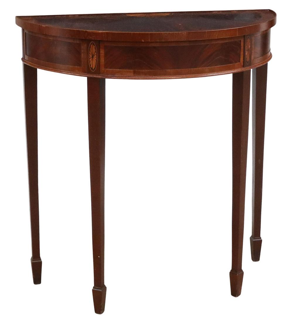 HEPPLEWHITE STYLE INLAID MAHOGANY DEMILUNE TABLE: Hepplewhite style inlaid mahogany console table, Hekman Furniture Company, late 20th c., demilune form, top with banded inlay, rising on tapered square legs, ending in spade feet, approx 31.25"h, 30"w
