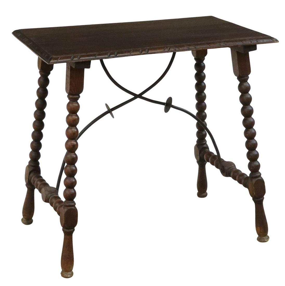 SPANISH BAROQUE STYLE TABLE ON BOBBIN LEGS: Spanish Baroque style table, late 19th c., rectangular top with molded edge, rising on bobbin turned legs, joined by side stretchers, wrought iron center stretchers, ending in turned feet, approx 26.5