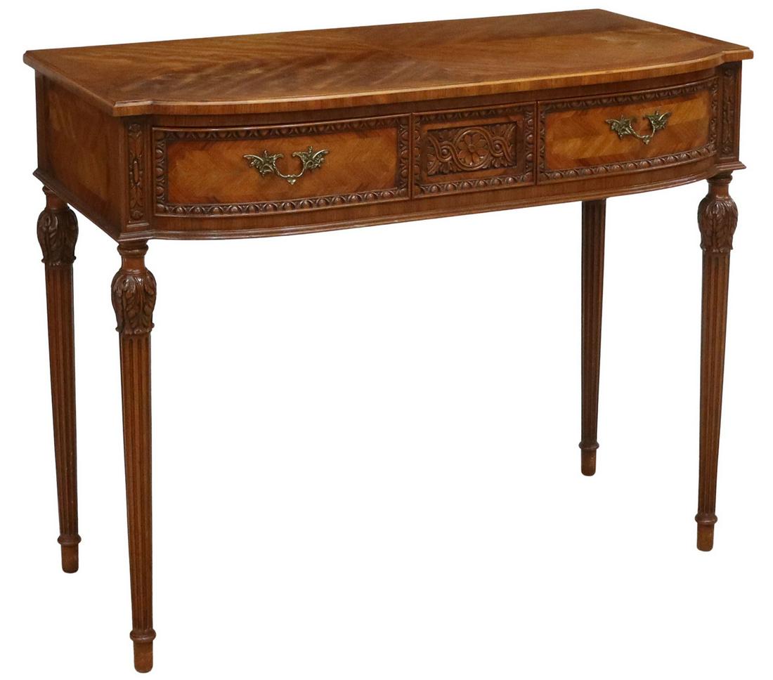 CARVED MAHOGANY CONSOLE HALL TABLE: Carved mahogany console table, late 20th c., matched veneer top with banded inlay, over two drawers, rising on fluted tapered legs with carved acanthus caps, approx 34.5"h, 42"w, 21"d **Provenance: A 
