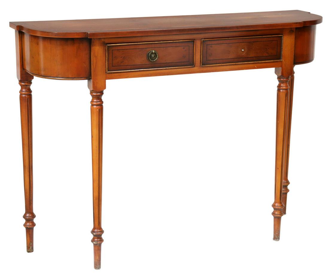 SHERATON STYLE DEMILUNE CONSOLE HALL TABLE: Sheraton style demilune console table, 20th c., two drawers, rising on fluted tapered legs, ending in blunt arrow feet, (one) drawer lacking pull, approx 30"h, 41"w, 11.5"d **Provenance: A fine Santa 
