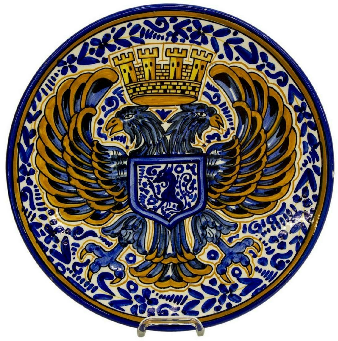 LARGE SPANISH MAJOLICA EARTHENWARE CHARGER: Large Spanish majolica earthenware charger, early 20th c., having crowned double-headed eagle emblazoned to the center, unsigned, small areas of glaze loss around rim, approx 15"diam, 3.5lbs **Provena