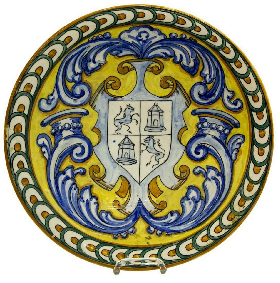 LARGE SPANISH MAJOLICA EARTHENWARE CHARGER: Large Spanish majolica earthenware charger, early 20th c., having glazed egg and dart border, shield with heraldic symbols emblazoned to the center, approx 15.5"diam, 4.5lbs **Provenance: A fine Santa