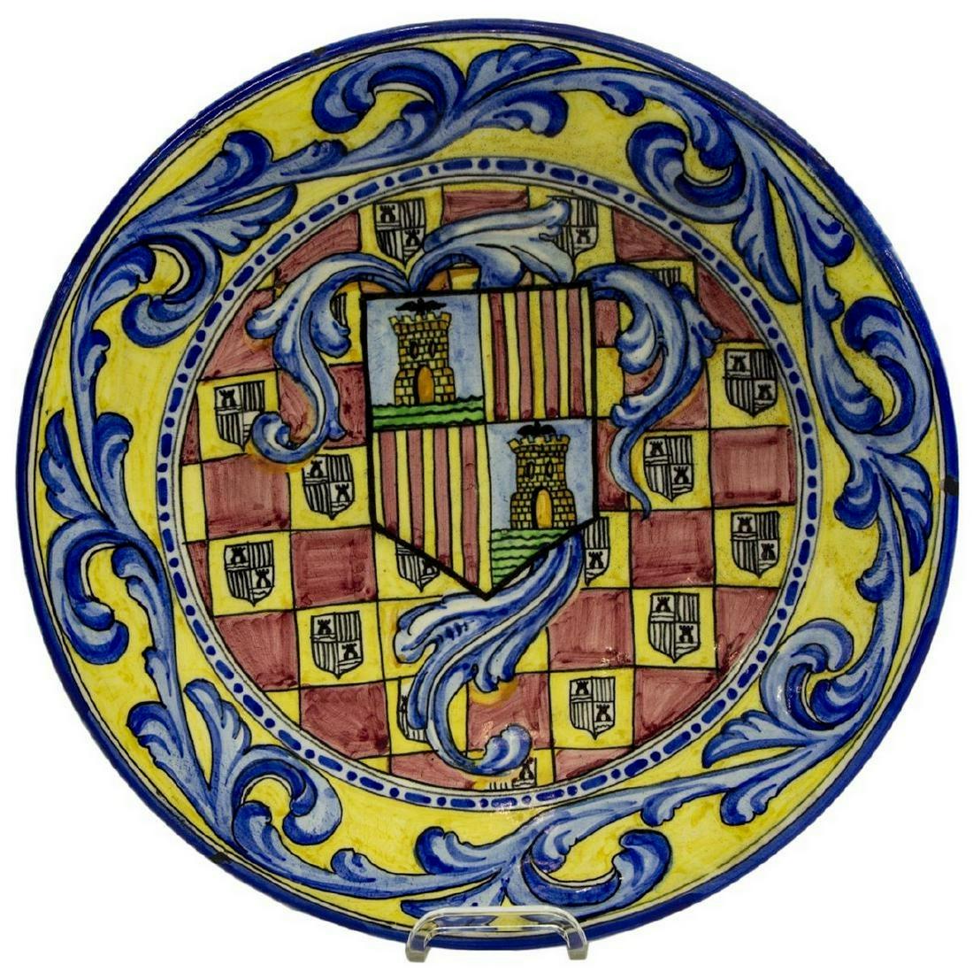 LARGE SPANISH MAJOLICA EARTHENWARE CHARGER: Large Spanish majolica earthenware charger, 20th c., having glazed scrolling foliate border, shield with repeated heraldic motif emblazoned to the center, some chips to glaze, approx 15.5"diam, 3.5lbs