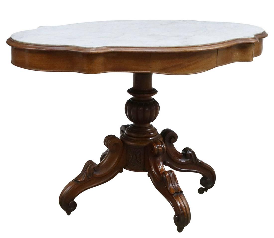 FRENCH NAPOLEON III MARBLE-TOP PEDESTAL TABLE: French Napoleon III period marble-top mahogany pedestal table, mid 19th c., having shaped inset marble top, conforming apron with two frieze drawers, over center pedestal support, rising on four scrol