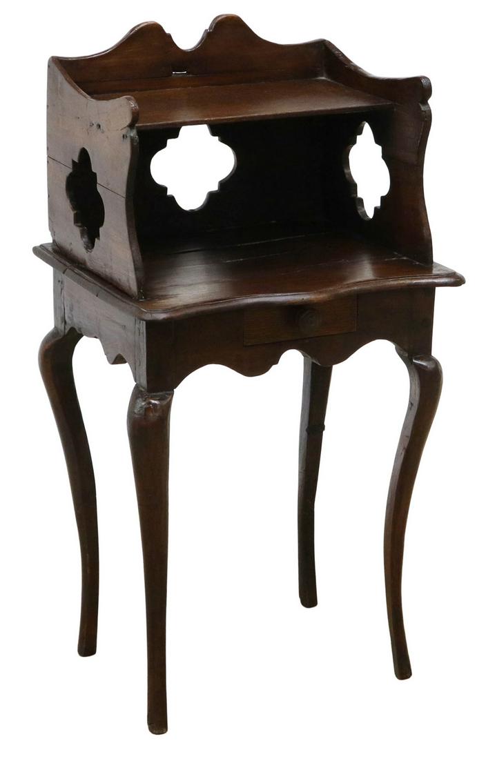 FRENCH PROVINCIAL OAK NIGHTSTAND: French Provincial oak nightstand, 19th c., two open shelves, side and back panels with pierced quatrefoils, small frieze drawer, rising on cabriole legs, splits, wood loss, approx 31.75"h, 16.5"w, 13.